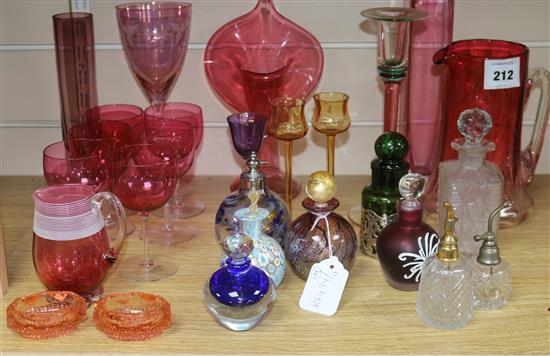 A quantity of coloured glass and scent bottles